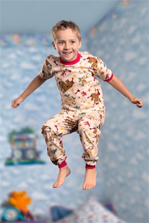 Boy Jumping on Bed Stock Photo - Rights-Managed, Code: 700-00514817