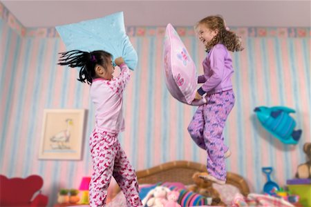 simsearch:700-00033360,k - Two Girls Having a Pillow Fight Stock Photo - Rights-Managed, Code: 700-00514824