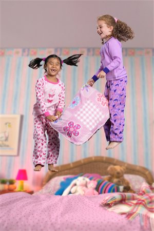 simsearch:700-00520129,k - Two Girls at a Sleepover, Jumping on the Bed Stock Photo - Rights-Managed, Code: 700-00514825