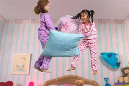 simsearch:700-00033360,k - Two Girls Having a Pillow Fight Stock Photo - Rights-Managed, Code: 700-00514826