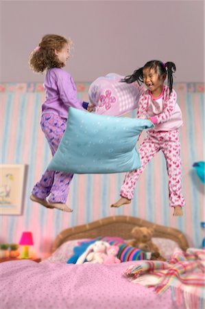 simsearch:700-00033360,k - Two Girls Having a Pillow Fight Stock Photo - Rights-Managed, Code: 700-00514827
