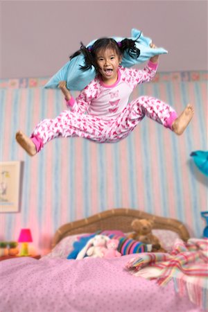 simsearch:700-00033360,k - Girl Jumping on Bed Stock Photo - Rights-Managed, Code: 700-00514823
