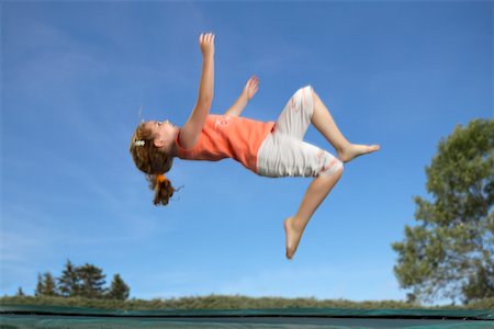 simsearch:700-00520129,k - Girl Jumping on Trampoline Stock Photo - Rights-Managed, Code: 700-00514835
