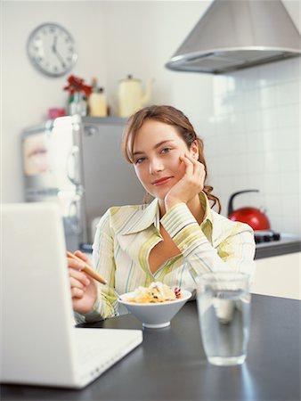 simsearch:700-00561804,k - Teenager Eating Cereal While Looking at Computer Stock Photo - Rights-Managed, Code: 700-00515128