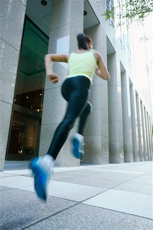 Runner Running Down City Street Stock Photo - Rights-Managed, Code: 700-00515300