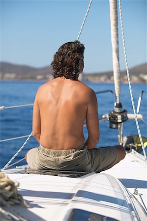 simsearch:700-00357729,k - Man Sitting on Boat Stock Photo - Rights-Managed, Code: 700-00515537