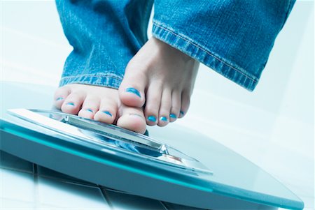 feet scale woman - Woman's Feet on Scale in Bathroom Stock Photo - Rights-Managed, Code: 700-00515705