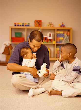 Family Playing on Floor Stock Photo - Rights-Managed, Code: 700-00517720