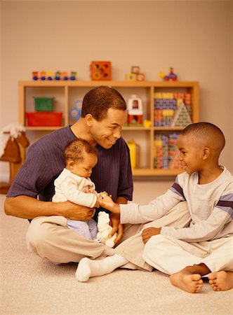 Family Playing on Floor Stock Photo - Rights-Managed, Code: 700-00517721
