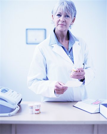 Pharmacist at Desk Stock Photo - Rights-Managed, Code: 700-00519265