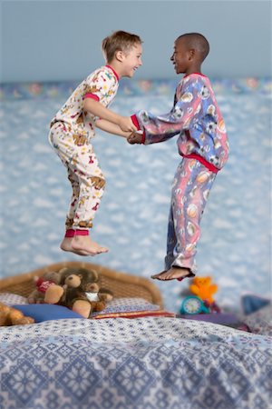 photo boys jumping bed - Children Jumping on Bed Stock Photo - Rights-Managed, Code: 700-00519347