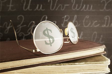 simsearch:700-00150473,k - Glasses with Dollar Sign on Stack of Books Stock Photo - Rights-Managed, Code: 700-00524129