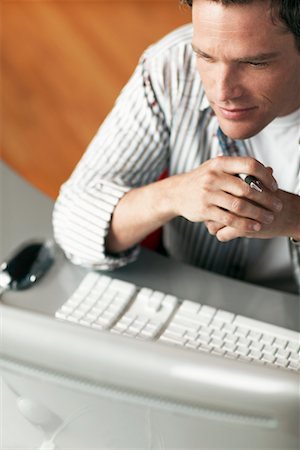 simsearch:700-00641415,k - Man Looking At Computer Screen Stock Photo - Rights-Managed, Code: 700-00524464