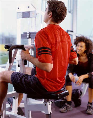 Man and Woman in Weight Room Stock Photo - Rights-Managed, Code: 700-00526648