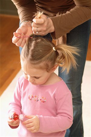 simsearch:700-02586125,k - Mother Tying Daughter's Hair into Pigtails Stock Photo - Rights-Managed, Code: 700-00527122