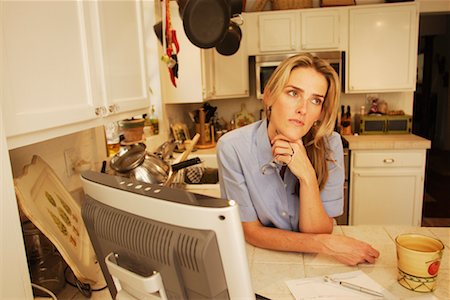 simsearch:700-00609249,k - Woman Thinking in Kitchen Stock Photo - Rights-Managed, Code: 700-00527411