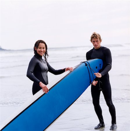 Man and Woman with Surfboard at The Beach Stock Photo - Rights-Managed, Code: 700-00527857