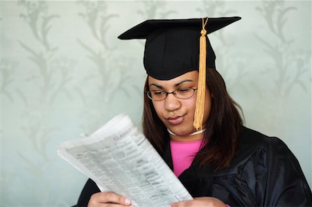simsearch:700-00521629,k - Graduate Reading Newspaper Stock Photo - Rights-Managed, Code: 700-00528226
