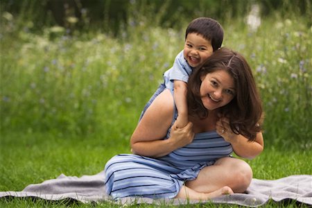 filipino dress - Child on Mother's Back Stock Photo - Rights-Managed, Code: 700-00528918