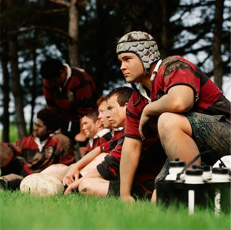 Rugby Team Sitting on Sidelines, Looking Upset Stock Photo - Rights-Managed, Code: 700-00529193