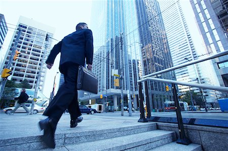 Businessman Rushing to Work Stock Photo - Rights-Managed, Code: 700-00529294