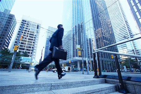 Businessman Rushing to Work Stock Photo - Rights-Managed, Code: 700-00529295
