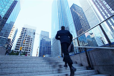 Businessman Rushing to Work Stock Photo - Rights-Managed, Code: 700-00529296