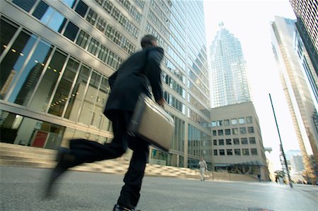 Businessman Rushing to Work Stock Photo - Rights-Managed, Code: 700-00529311