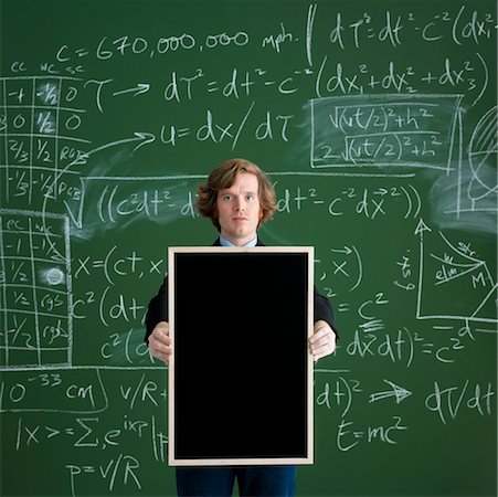 pupil in a empty classroom - Man Holding Blank Chalkboard Stock Photo - Rights-Managed, Code: 700-00529420