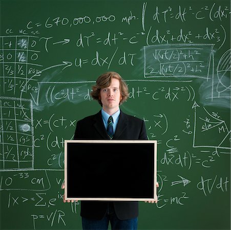 pupil in a empty classroom - Man Holding Blank Chalkboard Stock Photo - Rights-Managed, Code: 700-00529422