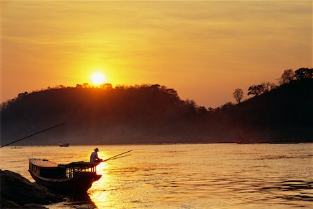 simsearch:700-02669459,k - Man Fishing at Sunset, Mekong River, Luang Prabang, Laos Stock Photo - Rights-Managed, Code: 700-00529436