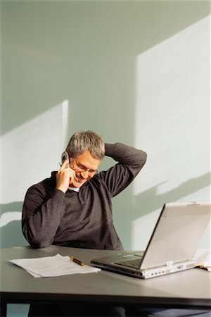 simsearch:700-04625359,k - Businessman In Office Talking On Cell Phone Stock Photo - Rights-Managed, Code: 700-00529583