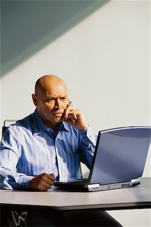 simsearch:700-00163379,k - Businessman using Laptop Computer And Cellular Phone Stock Photo - Rights-Managed, Code: 700-00529608