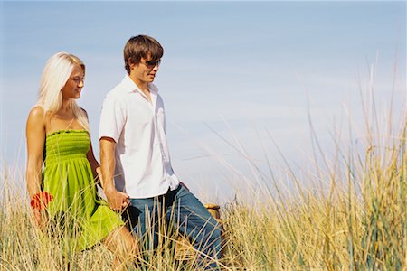 simsearch:700-00529622,k - Couple Walking Through Long Grass Stock Photo - Rights-Managed, Code: 700-00529620