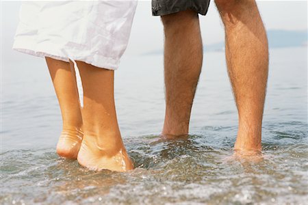 simsearch:700-00529622,k - Couple's Legs in Water Stock Photo - Rights-Managed, Code: 700-00529643