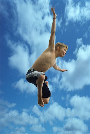 simsearch:700-00611099,k - Boy Jumping Outdoors Stock Photo - Rights-Managed, Code: 700-00520129