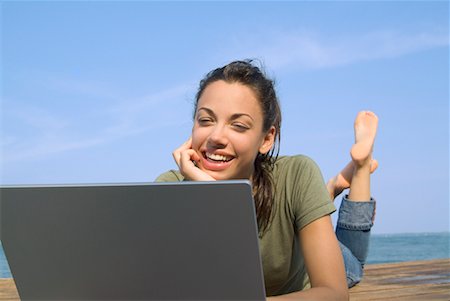 simsearch:700-00522867,k - Woman Lying on Dock, Using Laptop Stock Photo - Rights-Managed, Code: 700-00520122