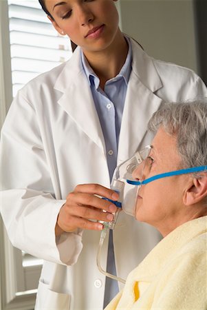 feeble - Doctor Helping Patient with Oxygen Mask Stock Photo - Rights-Managed, Code: 700-00520270