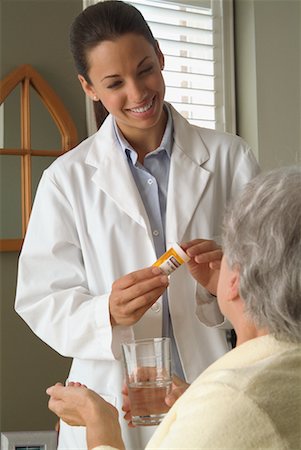 simsearch:6108-05867295,k - Doctor Giving Patient Medication Stock Photo - Rights-Managed, Code: 700-00520272