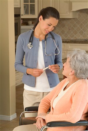 simsearch:600-03503186,k - Woman with Healthcare Worker Stock Photo - Rights-Managed, Code: 700-00520285