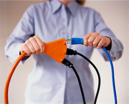 Woman with Extension Cord Stock Photo - Rights-Managed, Code: 700-00520706