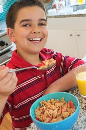 simsearch:700-00515127,k - Boy Eating Breakfast Stock Photo - Rights-Managed, Code: 700-00521017