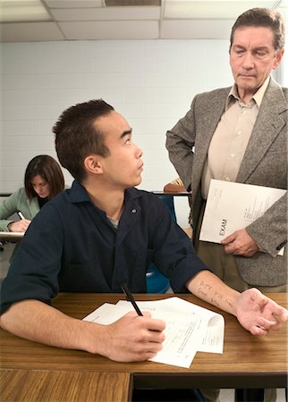 Student Getting Caught Cheating In Exam Stock Photo - Rights-Managed, Code: 700-00521023
