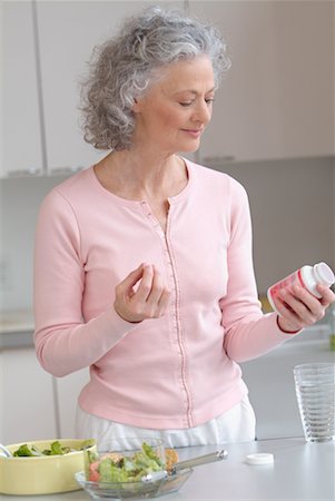 simsearch:6108-05867295,k - Woman Taking Pills Stock Photo - Rights-Managed, Code: 700-00521475