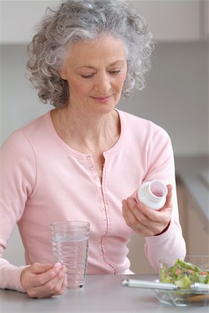 simsearch:6108-05867295,k - Woman Taking Pills Stock Photo - Rights-Managed, Code: 700-00521476