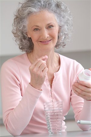 simsearch:6108-05867295,k - Woman Taking Pills Stock Photo - Rights-Managed, Code: 700-00521477