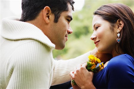 simsearch:700-00523685,k - Woman with Boyfriend Holding Dandelions Stock Photo - Rights-Managed, Code: 700-00522654