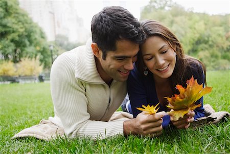 simsearch:700-00523685,k - Couple Lying on Grass Looking at Leaves Stock Photo - Rights-Managed, Code: 700-00522653