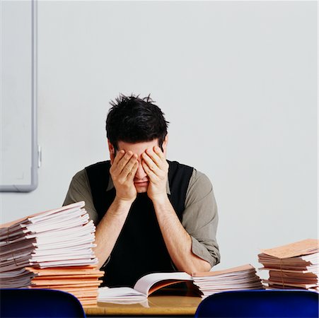 simsearch:700-00523344,k - Teacher at Desk with Head in Hands Stock Photo - Rights-Managed, Code: 700-00523344