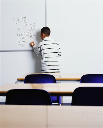 english bulletin board - Boy Solving Math Problems on Whiteboard Stock Photo - Rights-Managed, Code: 700-00523381
